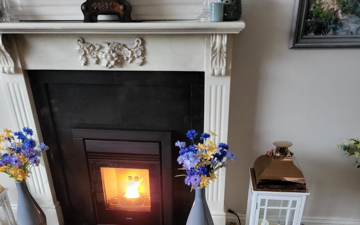 The same inset stove with the fire lit