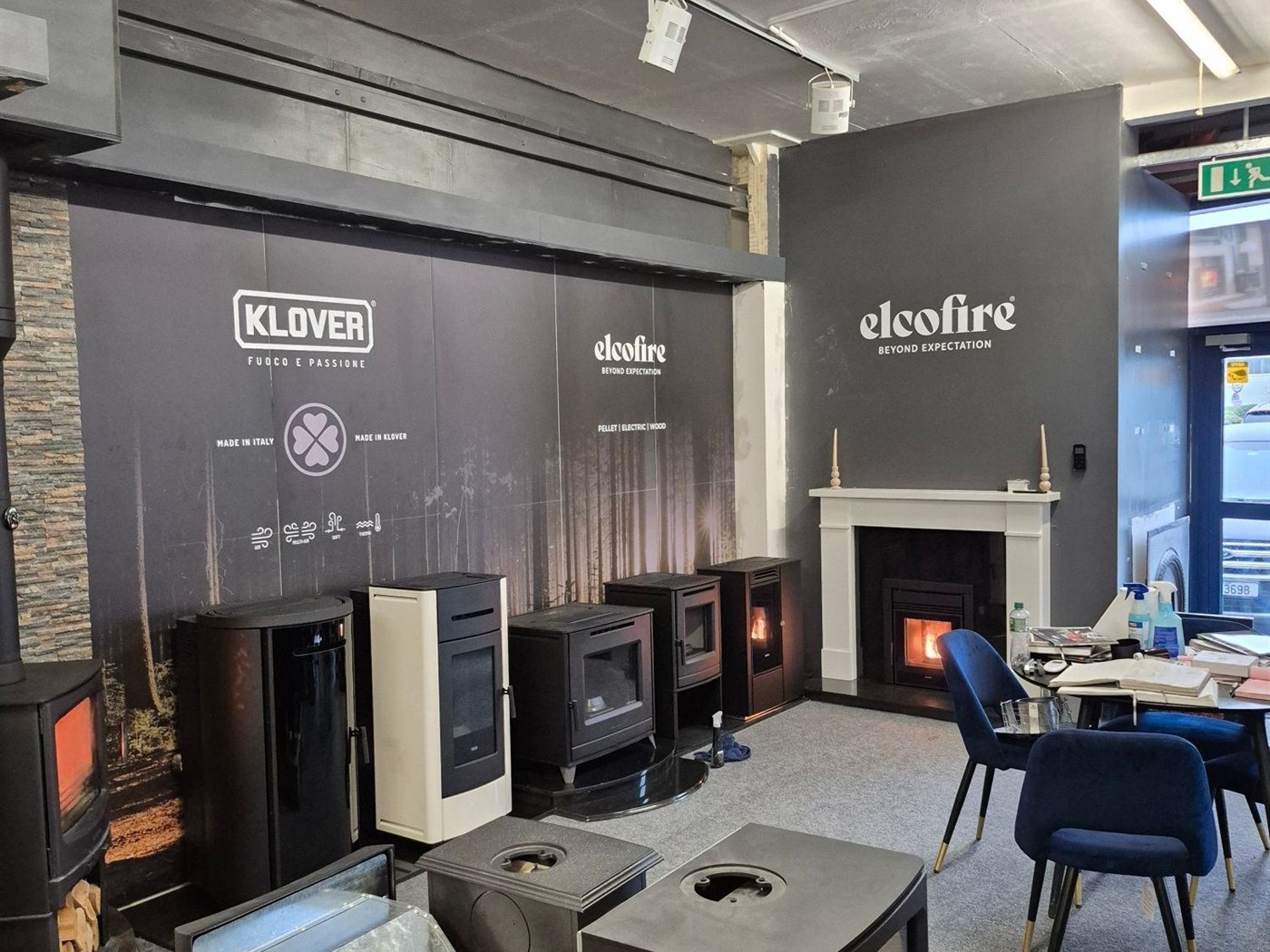 Inside the Stove Fit showroom in Clonmel: stoves and pellet stoves on display, several of them lit
